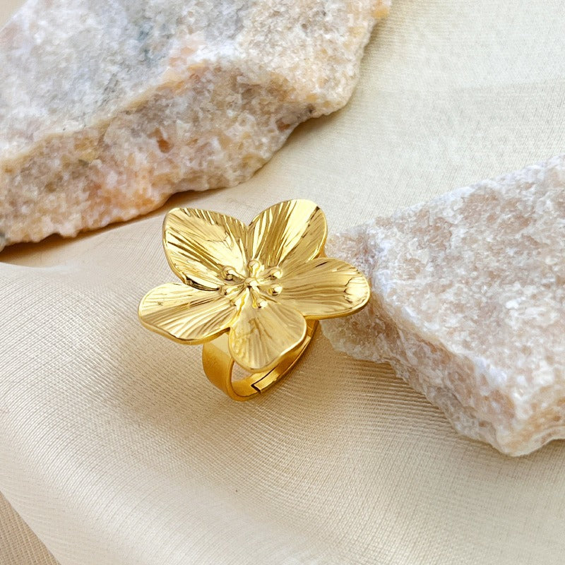 Rostfria blomring i guldfärg