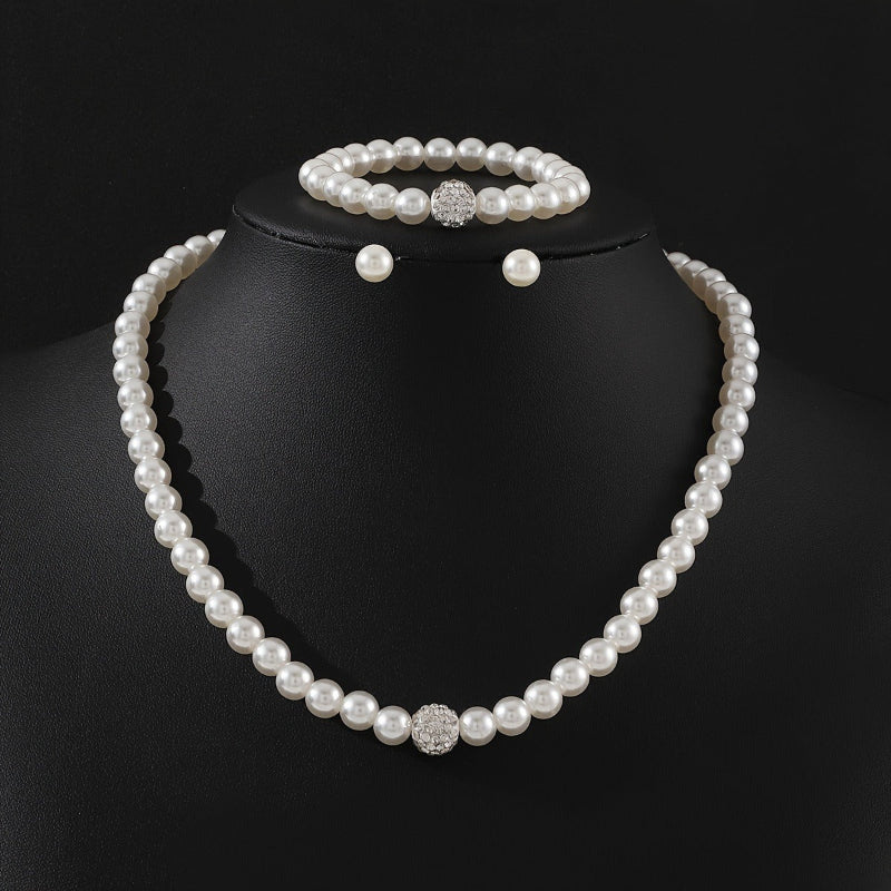 3‑delat smyckeset med imitationpärlor: halsband, armband och örhängen, silverfärg, kristalldetaljer, elegant